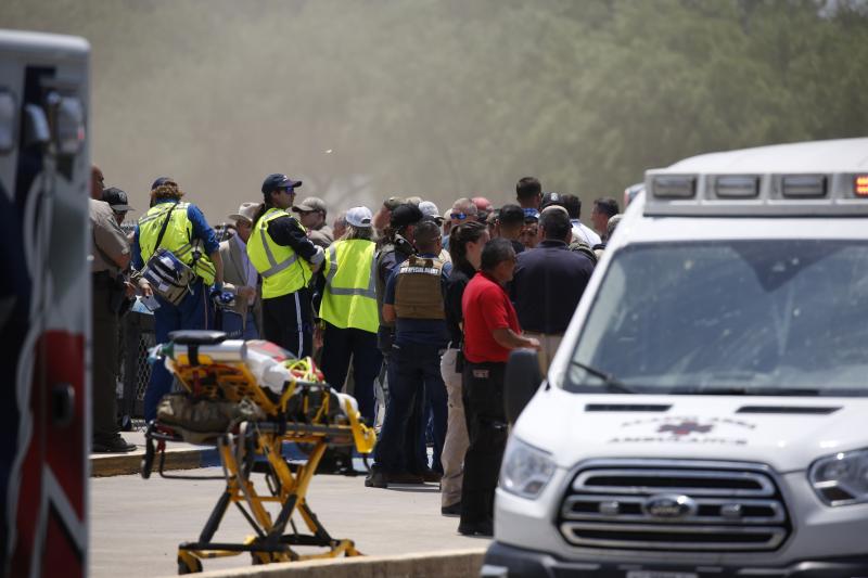 Emergency personnel gather near Robb Elementary School following a shooting Tuesday, May 24, 2022, in Uvalde, Texas. Nineteen children and two adults were shot and killed. Emergency personnel gather near Robb Elementary School following a shooting Tuesday, May 24, 2022, in Uvalde, Texas. Nineteen children and two adults were shot and killed.