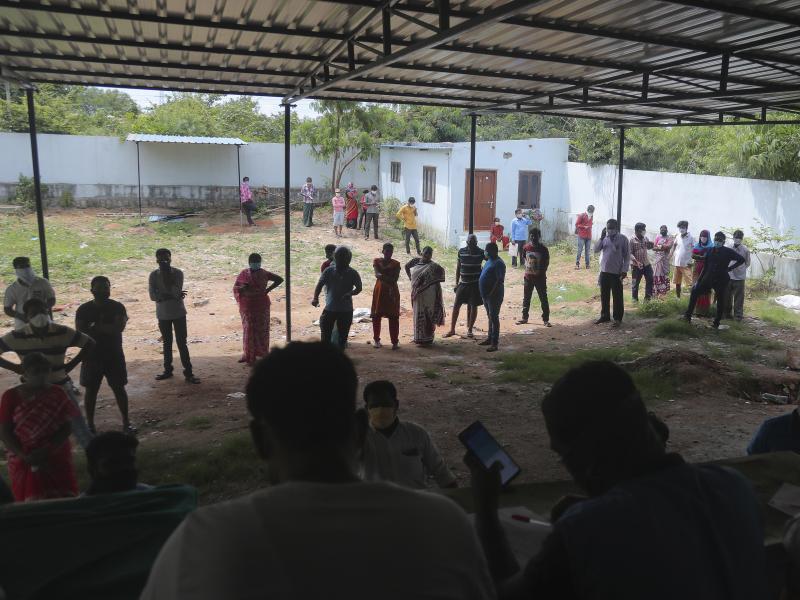People wait in a queue to register their names before giving their nasal swab samples to test for COVID-19 at a government health center in Hyderabad, India on Saturday. India's coronavirus cases have crossed 4 million. People wait in a queue to register their names before giving their nasal swab samples to test for COVID-19 at a government health center in Hyderabad, India on Saturday. India's coronavirus cases have crossed 4 million.