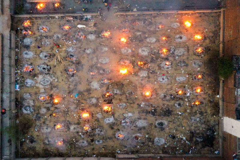 Victims of COVID-19 are cremated in funeral pyres this week in New Delhi. Scientists says the real death toll and number of infections are likely much higher than what the Indian government is reporting. Victims of COVID-19 are cremated in funeral pyres this week in New Delhi. Scientists says the real death toll and number of infections are likely much higher than what the Indian government is reporting.