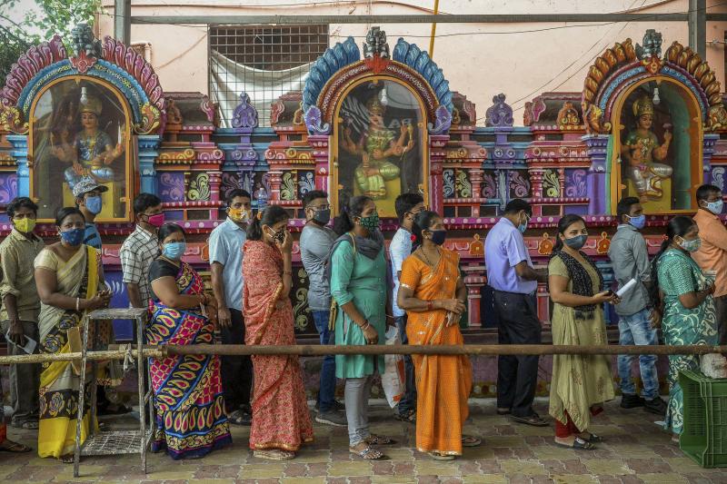 On June 25, people queued up to register for a COVID-19 vaccine at a site outside a Hindu temple in Hyderabad. Vaccinations are now being administered after a series of missteps led to a shortage of doses. If all goes well, India's public health agency ho On June 25, people queued up to register for a COVID-19 vaccine at a site outside a Hindu temple in Hyderabad. Vaccinations are now being administered after a series of missteps led to a shortage of doses. If all goes well, India's public health agency ho