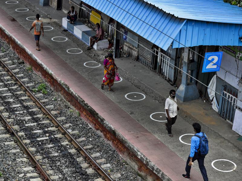 People walk through a railway station platform marked with circles to maintain physical distance in Kolkata, India, Monday. India's increasing coronavirus caseload made it the pandemic's second-worst-hit country behind the United States. People walk through a railway station platform marked with circles to maintain physical distance in Kolkata, India, Monday. India's increasing coronavirus caseload made it the pandemic's second-worst-hit country behind the United States.