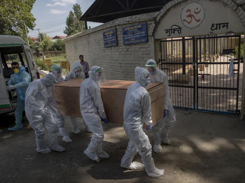Indian paramilitary soldiers carry the body of a paramilitary officer who died of COVID-19 to a crematorium in Srinagar, Indian-controlled Kashmir, on Tuesday. India is the third-ranked nation in the number of reported infections. Indian paramilitary soldiers carry the body of a paramilitary officer who died of COVID-19 to a crematorium in Srinagar, Indian-controlled Kashmir, on Tuesday. India is the third-ranked nation in the number of reported infections.