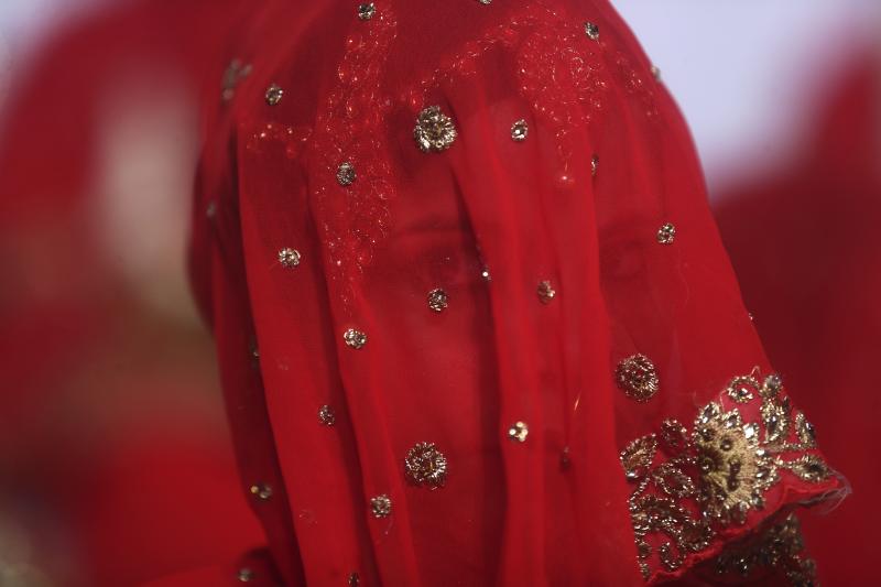 A bride in India. There's a movement to get the government to raise the legal age of marriage for women from 18 to 21. A bride in India. There's a movement to get the government to raise the legal age of marriage for women from 18 to 21.
