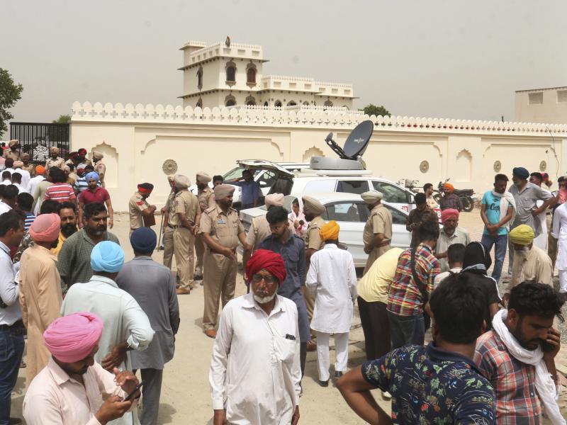 Villagers gather outside the residence of Shubhdeep Singh Sidhu, also known around the world by his stage name Sidhu Moose Wala, in a village near in Mansa, India on Monday. Villagers gather outside the residence of Shubhdeep Singh Sidhu, also known around the world by his stage name Sidhu Moose Wala, in a village near in Mansa, India on Monday.