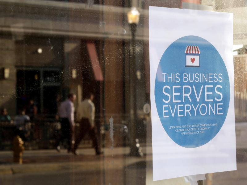 A sign reading, "This business serves everyone," was placed in the window of Bernadette's Barbershop in downtown Lafayette, Ind., in response to the passage of the state's Religious Freedom Restoration Act. A sign reading, "This business serves everyone," was placed in the window of Bernadette's Barbershop in downtown Lafayette, Ind., in response to the passage of the state's Religious Freedom Restoration Act.