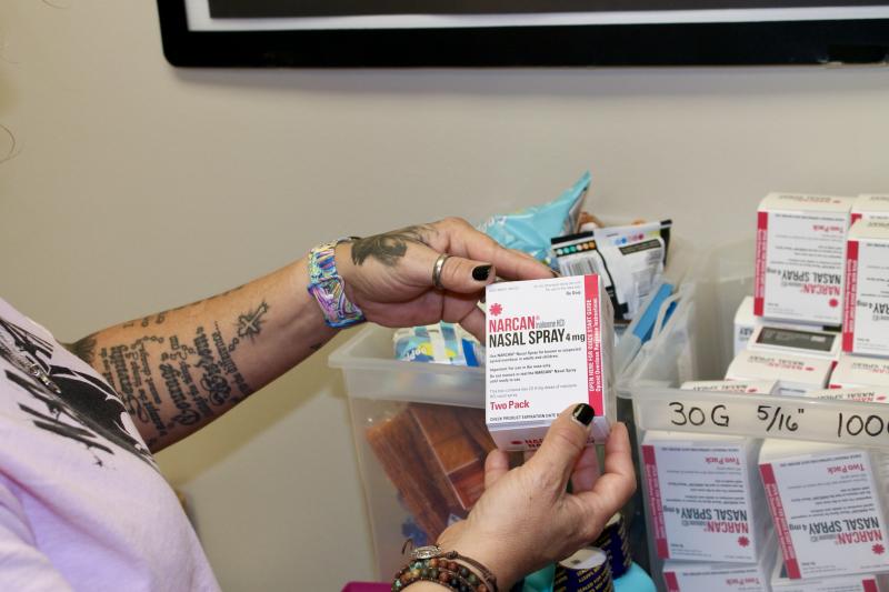 Kelly Hans holds a box of Narcan nasal spray at the county's One-Stop Shop in Austin. Kelly Hans holds a box of Narcan nasal spray at the county's One-Stop Shop in Austin.