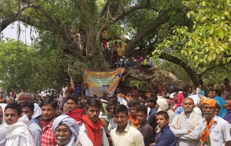 Villagers attend a campaign rally for India's ruling Bharatiya Janata Party in Ghazipur, in the northern state of Uttar Pradesh. Villagers attend a campaign rally for India's ruling Bharatiya Janata Party in Ghazipur, in the northern state of Uttar Pradesh.
