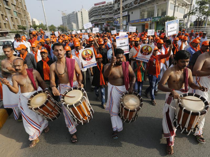 Devotees of Lord Ayyappa, the deity of the Sabarimala temple in India's Kerala state, protest a Supreme Court verdict in Ahmadabad, India, in October. The temple had barred women of menstruating age from entering the temple, but India's Supreme Court stru Devotees of Lord Ayyappa, the deity of the Sabarimala temple in India's Kerala state, protest a Supreme Court verdict in Ahmadabad, India, in October. The temple had barred women of menstruating age from entering the temple, but India's Supreme Court stru