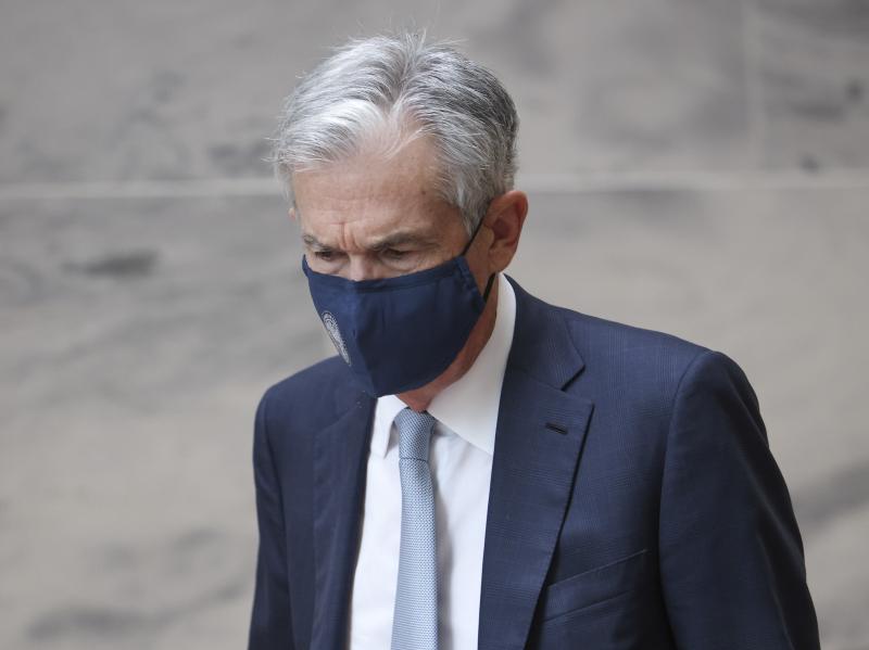 Federal Reserve Chairman Jerome Powell walks between meetings with senators on Capitol Hill on Oct. 6 in Washington, D.C. The Fed kept its interest rates near zero at the end of its policy meeting on Wednesday and announced a plan to start removing some o Federal Reserve Chairman Jerome Powell walks between meetings with senators on Capitol Hill on Oct. 6 in Washington, D.C. The Fed kept its interest rates near zero at the end of its policy meeting on Wednesday and announced a plan to start removing some o