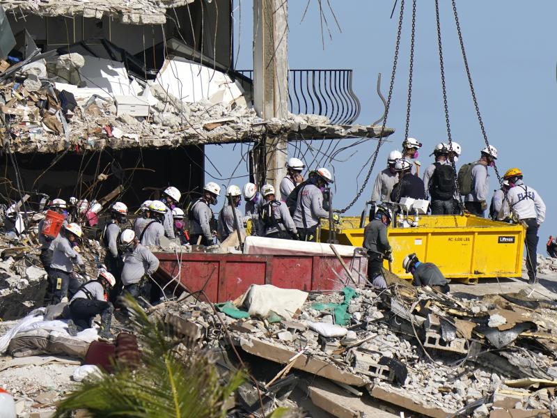 Rescue workers search for survivors in the rubble at the Champlain Towers South condo building in the town of Surfside, Fla. Some 150 people are still unaccounted for after the building partially collapsed last Thursday. Rescue workers search for survivors in the rubble at the Champlain Towers South condo building in the town of Surfside, Fla. Some 150 people are still unaccounted for after the building partially collapsed last Thursday.