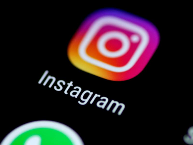 The Instagram app is seen on a phone screen. The Instagram app is seen on a phone screen.