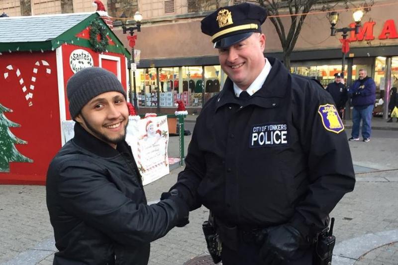 Yonkers community activist Hector Santiago demonstrates the "stop-and-shake" with Lt. Pat McCormack of the Yonkers Police Department. The idea, Santiago says, is to get people to introduce themselves to cops on the street. Yonkers community activist Hector Santiago demonstrates the "stop-and-shake" with Lt. Pat McCormack of the Yonkers Police Department. The idea, Santiago says, is to get people to introduce themselves to cops on the street.