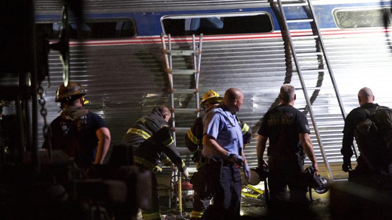 Emergency workers search for injured passengers after an Amtrak train carrying more than 230 people from Washington, D.C., to New York derailed in Philadelphia in May 2015. Emergency workers search for injured passengers after an Amtrak train carrying more than 230 people from Washington, D.C., to New York derailed in Philadelphia in May 2015.