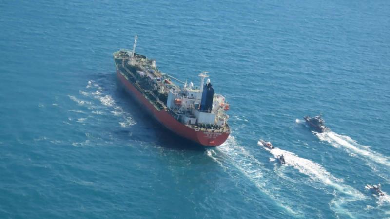 A seized South Korean-flagged tanker is escorted by Iranian Revolutionary Guard boats in the Persian Gulf. This comes as Tehran is enriching nuclear fuel to 20% purity. A seized South Korean-flagged tanker is escorted by Iranian Revolutionary Guard boats in the Persian Gulf. This comes as Tehran is enriching nuclear fuel to 20% purity.