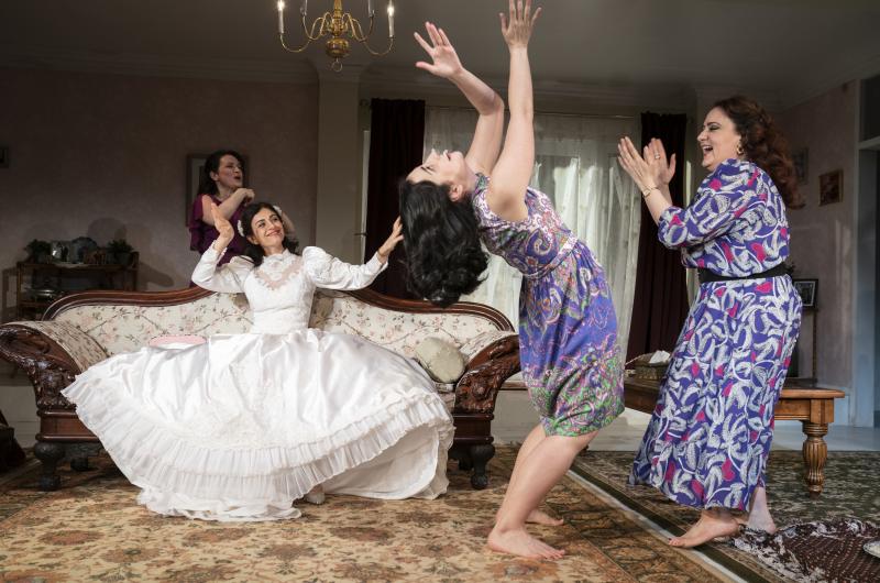 Marjan Neshat (in white dress), Roxanna Hope Radja (behind couch), Nikki Massoud and Artemis Pebdani in Wish You Were Here. Marjan Neshat (in white dress), Roxanna Hope Radja (behind couch), Nikki Massoud and Artemis Pebdani in Wish You Were Here.