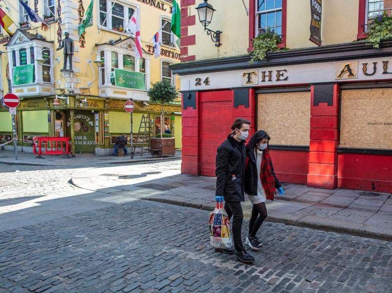 Bars, like this boarded-up pub in Dublin, closed in March. They can open their doors again in Phase Four of Ireland's reopening plan, which is newly delayed until August. Bars, like this boarded-up pub in Dublin, closed in March. They can open their doors again in Phase Four of Ireland's reopening plan, which is newly delayed until August.