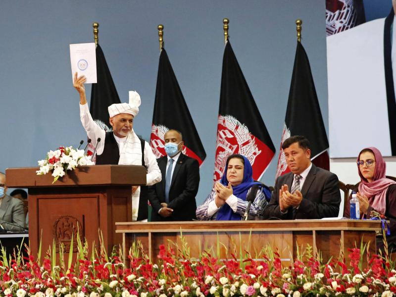 Afghan President Ashraf Ghani holds up a resolution on the last day of a traditional council known as a Loya Jirga, in Kabul, Afghanistan, Aug. 9. The council concluded with hundreds of delegates agreeing to free 400 Taliban members, paving the way for an Afghan President Ashraf Ghani holds up a resolution on the last day of a traditional council known as a Loya Jirga, in Kabul, Afghanistan, Aug. 9. The council concluded with hundreds of delegates agreeing to free 400 Taliban members, paving the way for an