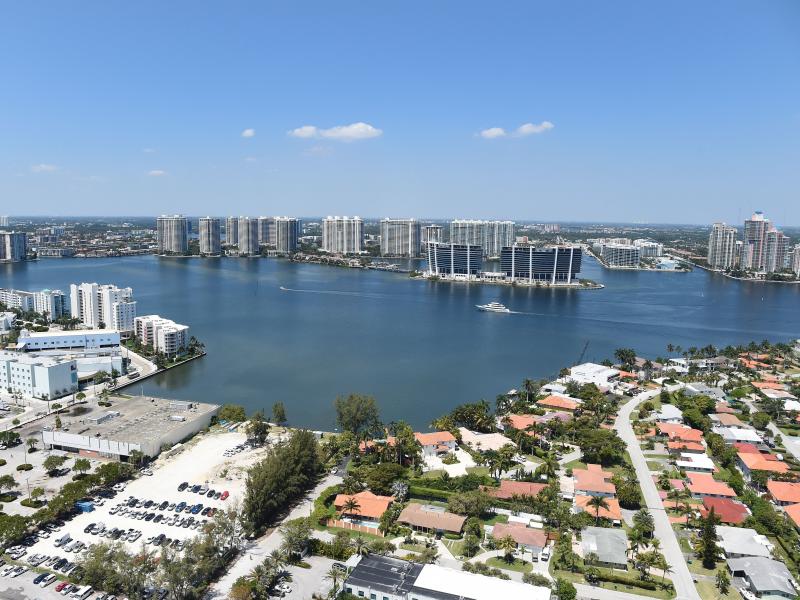 A new study has found that home sale prices and volume appear to be declining in Florida coastal areas at vulnerable to rising sea levels compared to coastal areas with less risk. Here, the balcony view from a luxury condo in Sunny Isles Beach, Fla., in 2 A new study has found that home sale prices and volume appear to be declining in Florida coastal areas at vulnerable to rising sea levels compared to coastal areas with less risk. Here, the balcony view from a luxury condo in Sunny Isles Beach, Fla., in 2