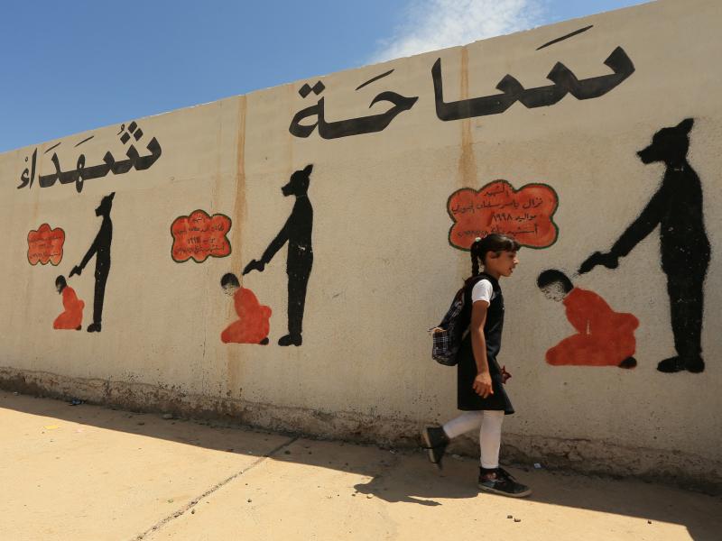 In Mosul, reminders of the Islamic State's brutal rule include a school wall covered with drawings showing how militants executed their prisoners. The U.N. says the area around the city holds mass graves where thousands of people were buried. In Mosul, reminders of the Islamic State's brutal rule include a school wall covered with drawings showing how militants executed their prisoners. The U.N. says the area around the city holds mass graves where thousands of people were buried.