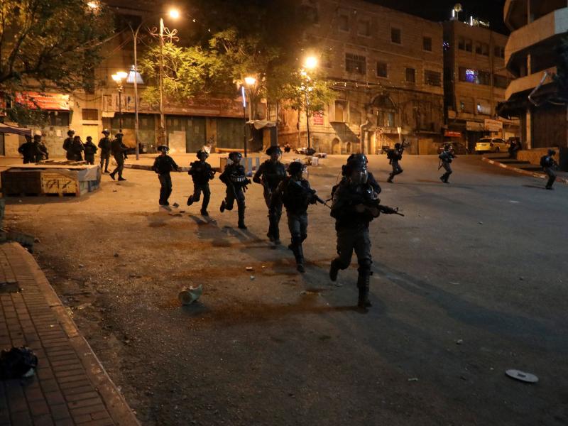 Israeli security forces on a street during clashes with Palestinian youth in Hebron on April 25. Israeli security forces on a street during clashes with Palestinian youth in Hebron on April 25.