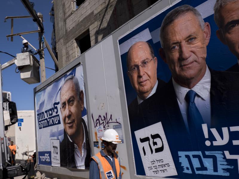 Election campaign billboards in Tel Aviv showing Israeli Prime Minister and head of the Likud party Benjamin Netanyahu (left), alongside the Blue and White alliance leaders Moshe Yaalon and Benny Gantz. Election campaign billboards in Tel Aviv showing Israeli Prime Minister and head of the Likud party Benjamin Netanyahu (left), alongside the Blue and White alliance leaders Moshe Yaalon and Benny Gantz.