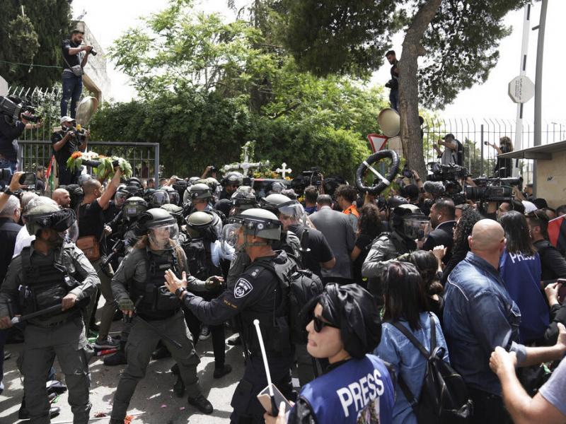 Israeli police in riot gear confront mourners and the journalists on Friday covering the transfer from the hospital of slain Al Jazeera veteran journalist Shireen Abu Akleh to her final resting place in east Jerusalem. Abu Akleh, a Palestinian-American re Israeli police in riot gear confront mourners and the journalists on Friday covering the transfer from the hospital of slain Al Jazeera veteran journalist Shireen Abu Akleh to her final resting place in east Jerusalem. Abu Akleh, a Palestinian-American re