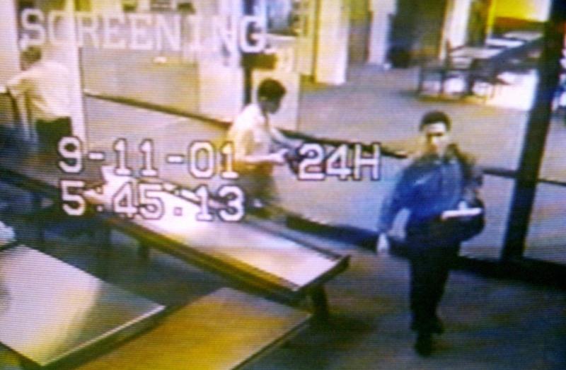 Two men identified by authorities as hijackers Mohamed Atta (right) and Abdulaziz Alomari (center) pass through airport security on Sept. 11, 2001, at Portland International Jetport in Maine in an image from airport surveillance tape released on Sept. 19, Two men identified by authorities as hijackers Mohamed Atta (right) and Abdulaziz Alomari (center) pass through airport security on Sept. 11, 2001, at Portland International Jetport in Maine in an image from airport surveillance tape released on Sept. 19,