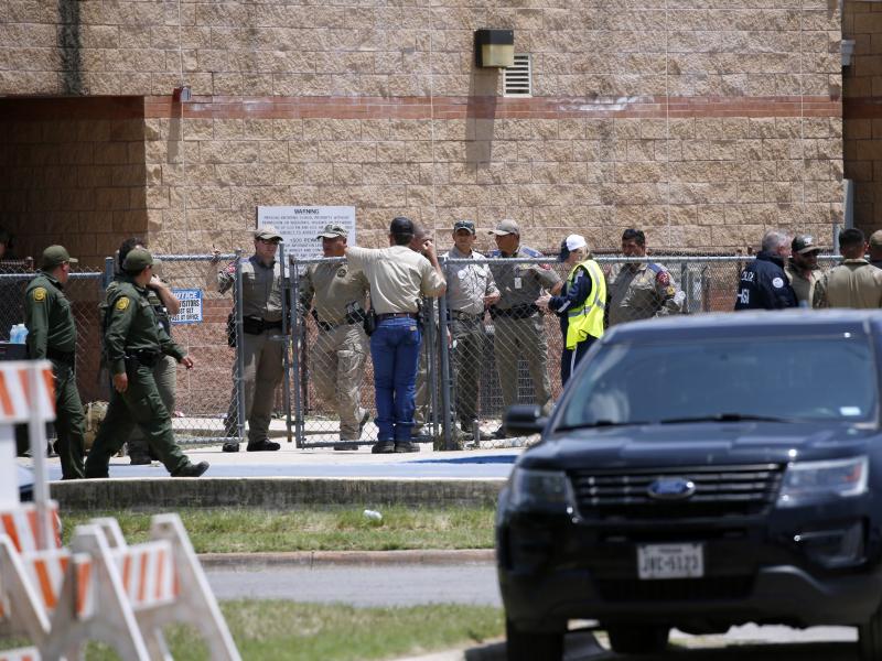 Law enforcement and first responders gather outside Robb Elementary School following Tuesday's shooting in Uvalde, Texas. Their response has since come under wide scrutiny. Law enforcement and first responders gather outside Robb Elementary School following Tuesday's shooting in Uvalde, Texas. Their response has since come under wide scrutiny.
