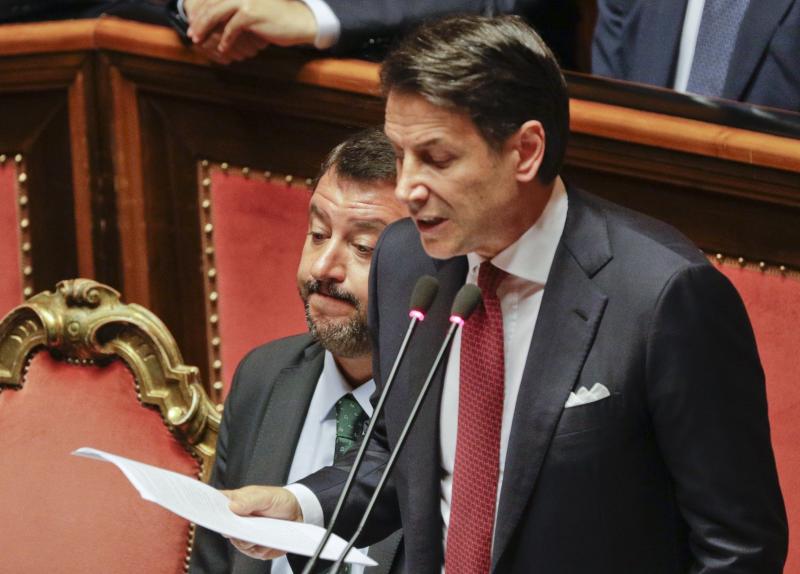 Italian Premier Giuseppe Conte (right) speaks to the Senate on Tuesday next to Deputy Premier Matteo Salvini. Italian Premier Giuseppe Conte (right) speaks to the Senate on Tuesday next to Deputy Premier Matteo Salvini.