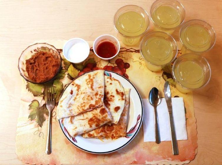 An example of one of the study's ultra-processed lunches consists of quesadillas, refried beans and diet lemonade. Participants on this diet ate an average of 508 calories more per day and gained an average of 2 pounds over two weeks. An example of one of the study's ultra-processed lunches consists of quesadillas, refried beans and diet lemonade. Participants on this diet ate an average of 508 calories more per day and gained an average of 2 pounds over two weeks.