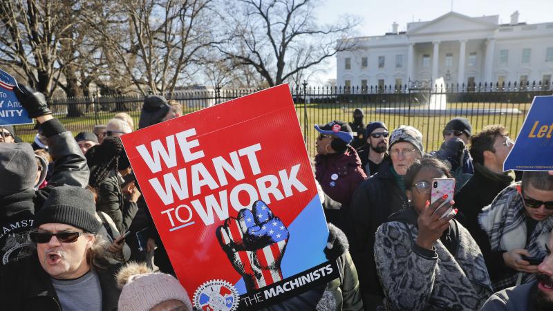 Union members and other federal employees protest in front of the White House on Thursday. Many are out of work as the partial government shutdown has dragged on longer than any in history. Union members and other federal employees protest in front of the White House on Thursday. Many are out of work as the partial government shutdown has dragged on longer than any in history.