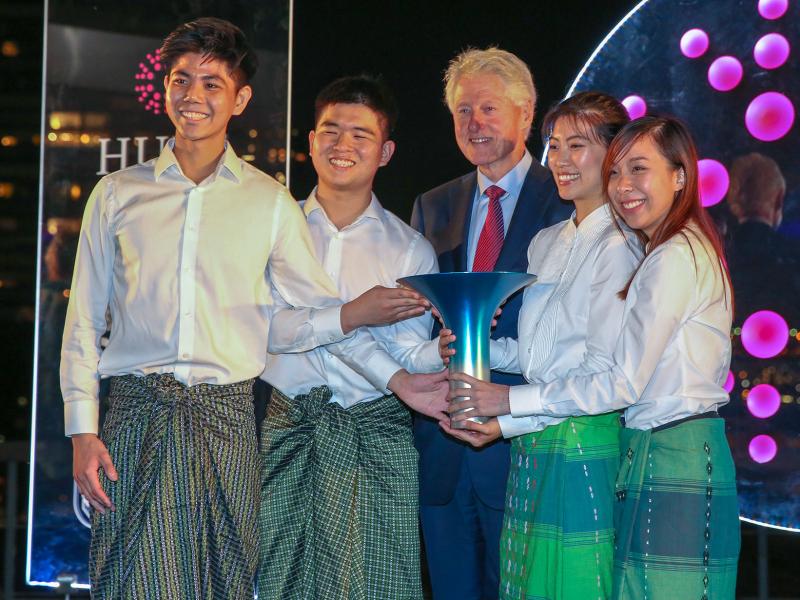 Members of the winning team pose with former President Bill Clinton during the Hult Prize Awards Dinner at U.N. headquarters. From left: Kisum Chan, Lincoln Lee, Julia Vannaxay, Vannie Koay Members of the winning team pose with former President Bill Clinton during the Hult Prize Awards Dinner at U.N. headquarters. From left: Kisum Chan, Lincoln Lee, Julia Vannaxay, Vannie Koay
