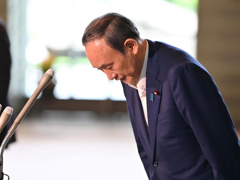 Japan's Prime Minister Yoshihide Suga bows during a press conference at the prime minister's office in Tokyo on Friday, following his announcement that he will not seek reelection for Liberal Democratic Party leadership this month. Japan's Prime Minister Yoshihide Suga bows during a press conference at the prime minister's office in Tokyo on Friday, following his announcement that he will not seek reelection for Liberal Democratic Party leadership this month.