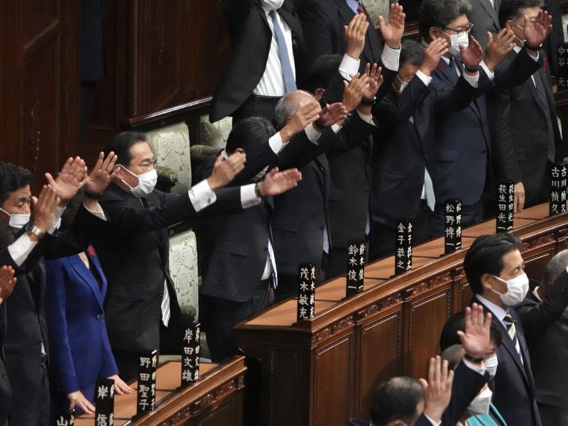 Japanese Prime Minister Fumio Kishida, forth from left, and other lawmakers give three cheers after dissolving the lower house, the more powerful of the two parliamentary chambers, during an extraordinary Diet session at the lower house of parliament Thur Japanese Prime Minister Fumio Kishida, forth from left, and other lawmakers give three cheers after dissolving the lower house, the more powerful of the two parliamentary chambers, during an extraordinary Diet session at the lower house of parliament Thur