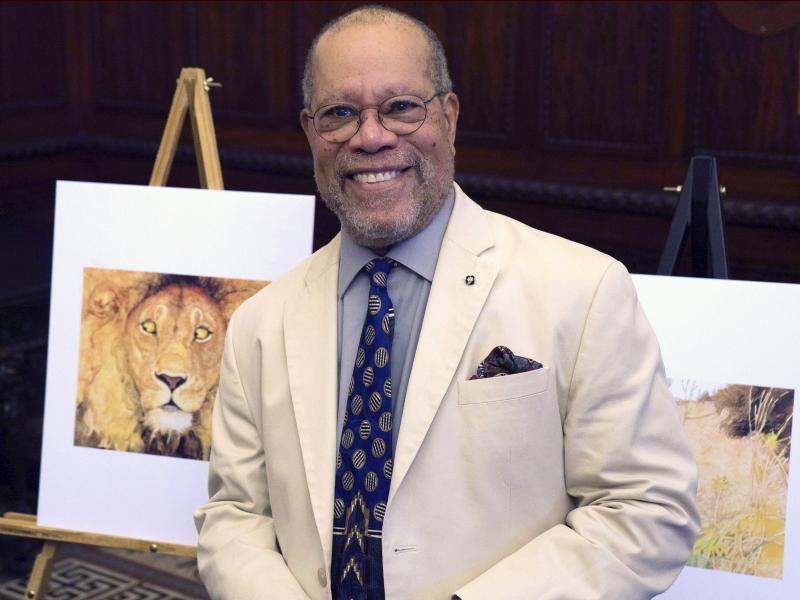 Children's book illustrator Jerry Pinkney poses in front of two of his illustrations in 2016, at the City Hall in Philadelphia. Children's book illustrator Jerry Pinkney poses in front of two of his illustrations in 2016, at the City Hall in Philadelphia.