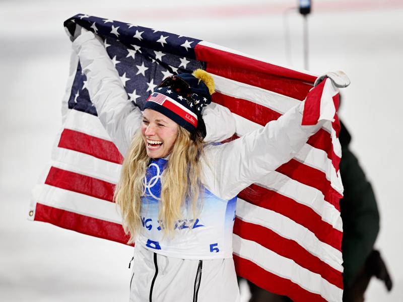 Jessie Diggins of Team USA celebrates after winning the bronze medal in the women's cross-country sprint event on Day 4 of the Beijing 2022 Winter Olympic Games in China. Jessie Diggins of Team USA celebrates after winning the bronze medal in the women's cross-country sprint event on Day 4 of the Beijing 2022 Winter Olympic Games in China.