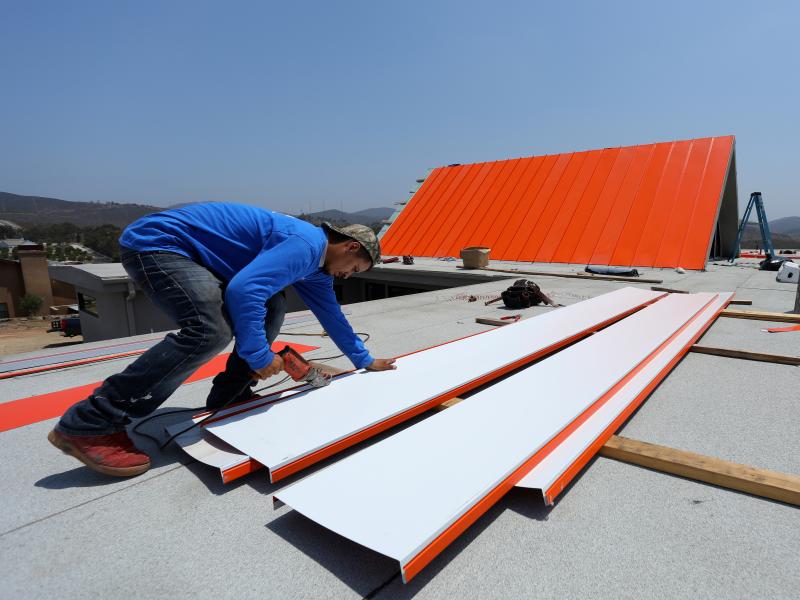A worker installs a roof on a home being built in San Diego in 2017. The housing market has been softening, with sales of new single-family homes falling in October to the lowest level in more than 2 1/2 years. A worker installs a roof on a home being built in San Diego in 2017. The housing market has been softening, with sales of new single-family homes falling in October to the lowest level in more than 2 1/2 years.