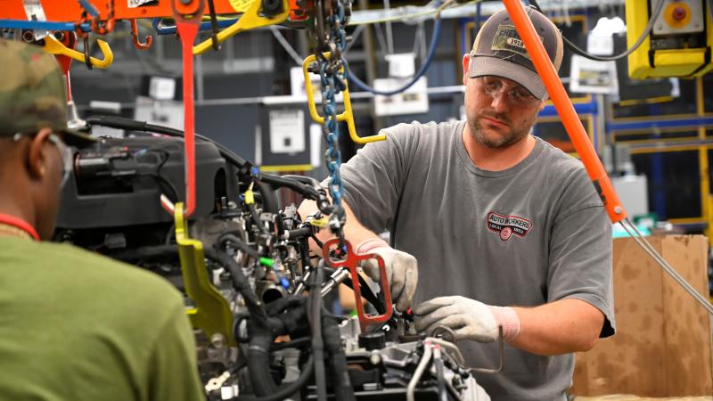 Workers assemble engines along the line at a General Motors plant in Spring Hill, Tenn. A nationwide strike by the United Automobile Workers at GM plants didn't hurt U.S. job growth in October. Workers assemble engines along the line at a General Motors plant in Spring Hill, Tenn. A nationwide strike by the United Automobile Workers at GM plants didn't hurt U.S. job growth in October.