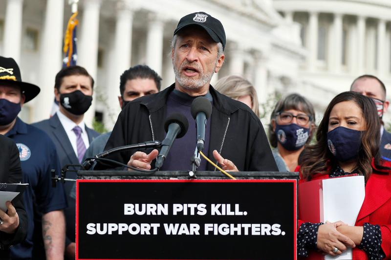 Comedian, writer and veterans advocate Jon Stewart speaks at a press conference on "The Presumptive Benefits for War Fighters Exposed to Burn Pits and Other Toxins Act of 2020" at the House Triangle in Washington, D.C., on Tuesday. Comedian, writer and veterans advocate Jon Stewart speaks at a press conference on "The Presumptive Benefits for War Fighters Exposed to Burn Pits and Other Toxins Act of 2020" at the House Triangle in Washington, D.C., on Tuesday.