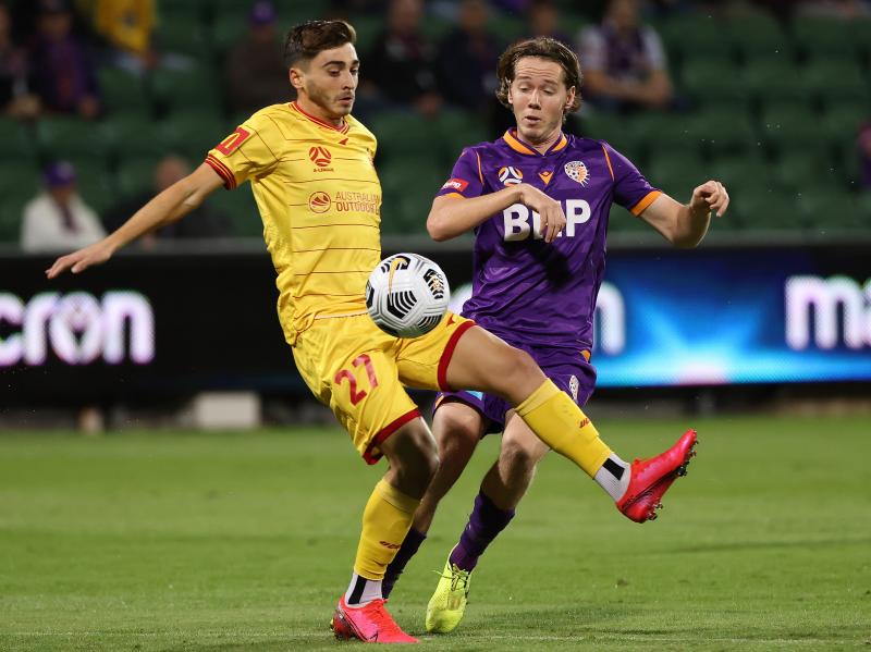 Josh Cavallo of Adelaide, left, and Daniel Stynes of the Glory contest for the ball during the A-League match between Perth Glory and Adelaide United at HBF Park, on May 19 in Perth, Australia. Josh Cavallo of Adelaide, left, and Daniel Stynes of the Glory contest for the ball during the A-League match between Perth Glory and Adelaide United at HBF Park, on May 19 in Perth, Australia.