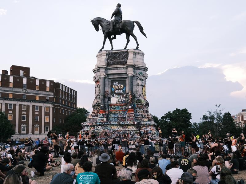The Robert E. Lee statue on Richmond's Monument Avenue is seen here during a violin vigil to remember Elijah McClain in July. The Robert E. Lee statue on Richmond's Monument Avenue is seen here during a violin vigil to remember Elijah McClain in July.