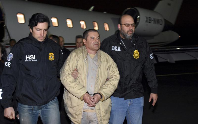 U.S. law enforcement personnel escort Joaquín "El Chapo" Guzmán from a plane to a waiting caravan of SUVs at New York's Long Island MacArthur Airport in January 2017. U.S. law enforcement personnel escort Joaquín "El Chapo" Guzmán from a plane to a waiting caravan of SUVs at New York's Long Island MacArthur Airport in January 2017.