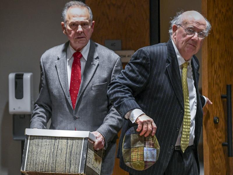 Former Alabama Chief Justice Roy Moore, left, and his attorney Julian McPhillips leave the courtroom in the Montgomery County Courthouse in Montgomery, Ala., on Jan. 24 following jury selection. Former Alabama Chief Justice Roy Moore, left, and his attorney Julian McPhillips leave the courtroom in the Montgomery County Courthouse in Montgomery, Ala., on Jan. 24 following jury selection.