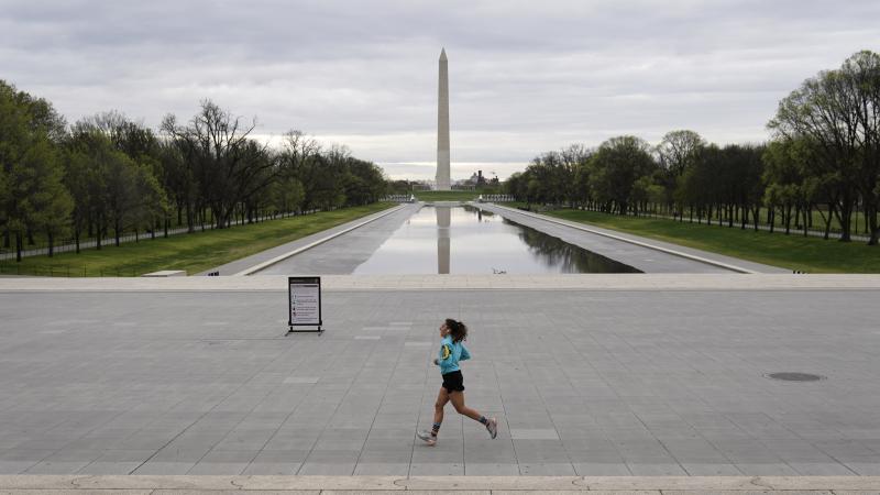 A woman jogs along a mostly empty National Mall on March 31, 2020 in Washington, D.C. To prevent the spread of the coronavirus, Virginia, Maryland and the District of Columbia all announced stay-at-home orders this week, which strongly discourage resident A woman jogs along a mostly empty National Mall on March 31, 2020 in Washington, D.C. To prevent the spread of the coronavirus, Virginia, Maryland and the District of Columbia all announced stay-at-home orders this week, which strongly discourage resident