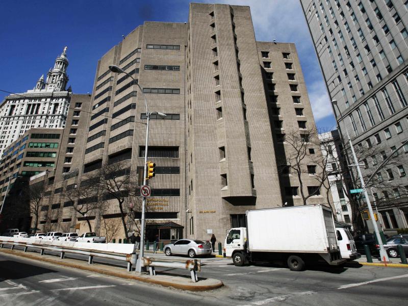 The warden of the Metropolitan Correctional Center in New York City has been reassigned and two others suspended pending official investigations, the Justice Department said. The warden of the Metropolitan Correctional Center in New York City has been reassigned and two others suspended pending official investigations, the Justice Department said.