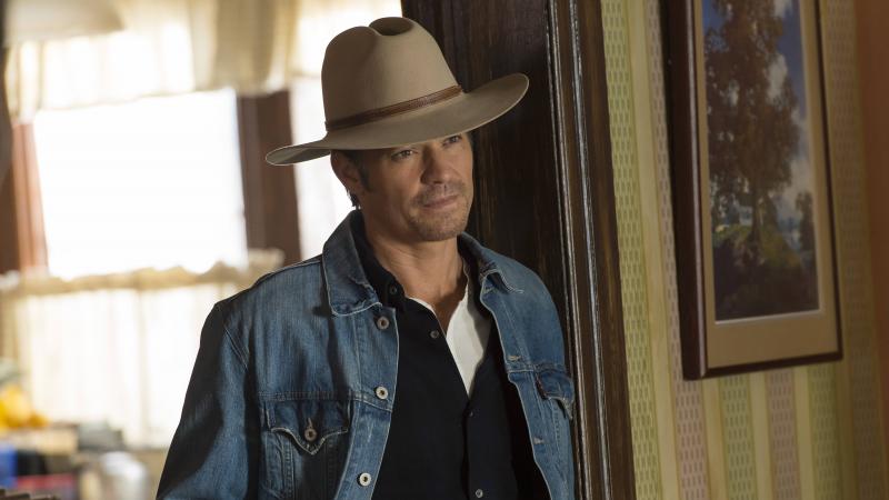 Timothy Olyphant plays Deputy U.S. Marshal Raylan Givens on FX's Justified, which is based on a novella by Elmore Leonard. The show's creator, Graham Yost, says the only "tussle" the writers had with Leonard happened during the pilot, over which hat Rayla Timothy Olyphant plays Deputy U.S. Marshal Raylan Givens on FX's Justified, which is based on a novella by Elmore Leonard. The show's creator, Graham Yost, says the only "tussle" the writers had with Leonard happened during the pilot, over which hat Rayla
