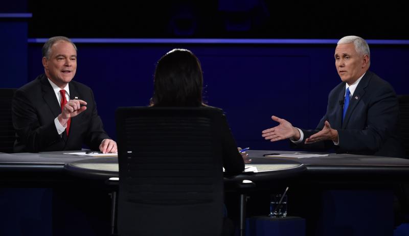 Tim Kaine (left) and Mike Pence take questions from moderator Elaine Quijano during the vice presidential debate at Longwood University in Farmville, Va., on Tuesday. Tim Kaine (left) and Mike Pence take questions from moderator Elaine Quijano during the vice presidential debate at Longwood University in Farmville, Va., on Tuesday.