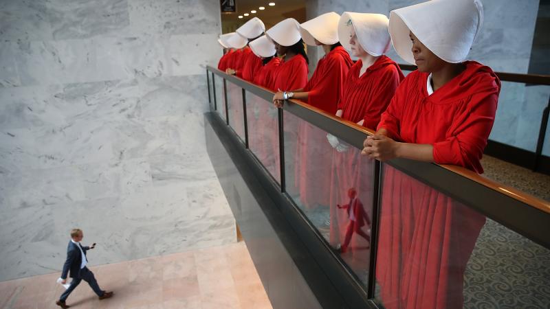 Protesters dressed as characters from The Handmaid's Tale outside the confirmation hearing for Brett Kavanaugh on Tuesday. Protesters dressed as characters from The Handmaid's Tale outside the confirmation hearing for Brett Kavanaugh on Tuesday.