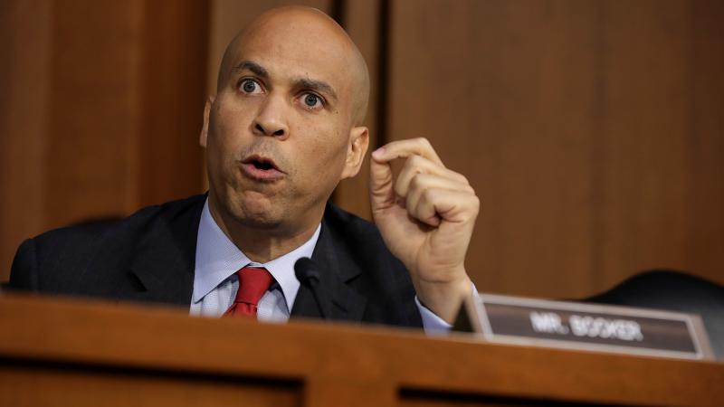 Sen. Cory Booker, D-N.J., argues with Republican members of the Senate Judiciary Committee during the third day of Supreme Court nominee Judge Brett Kavanaugh's confirmation hearings on Thursday. Sen. Cory Booker, D-N.J., argues with Republican members of the Senate Judiciary Committee during the third day of Supreme Court nominee Judge Brett Kavanaugh's confirmation hearings on Thursday.