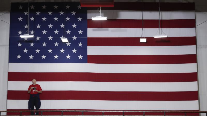 A volunteer stands in front of an American flag before President Trump speaks at a rally last week in Indianapolis. Indiana is a key Senate battleground state for the GOP. A volunteer stands in front of an American flag before President Trump speaks at a rally last week in Indianapolis. Indiana is a key Senate battleground state for the GOP.